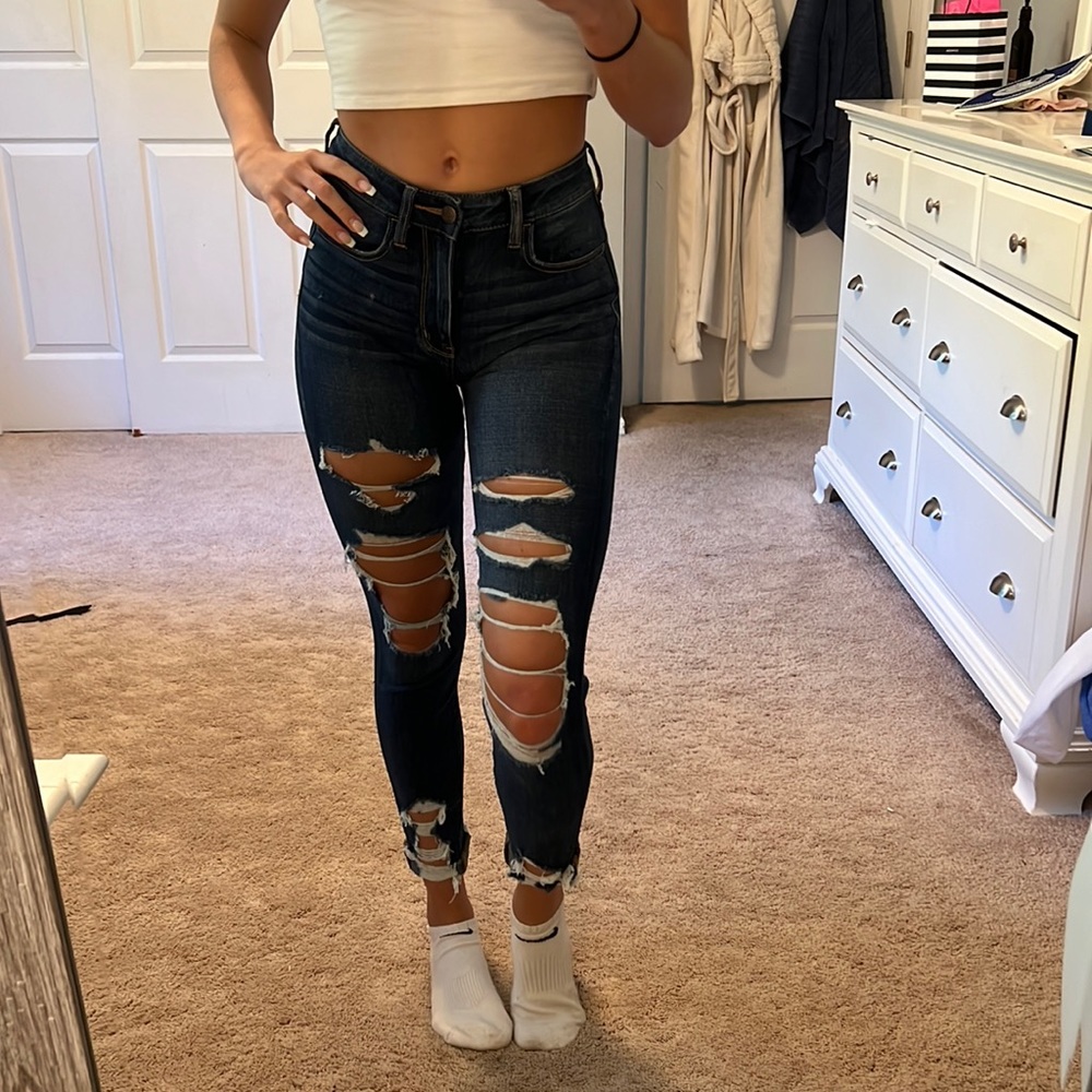 dark wash skinny ripped jeans.